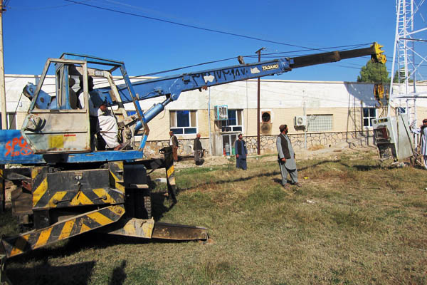 A crane moves an old autoclave at Bost Provincial Hospital, Afghanistan